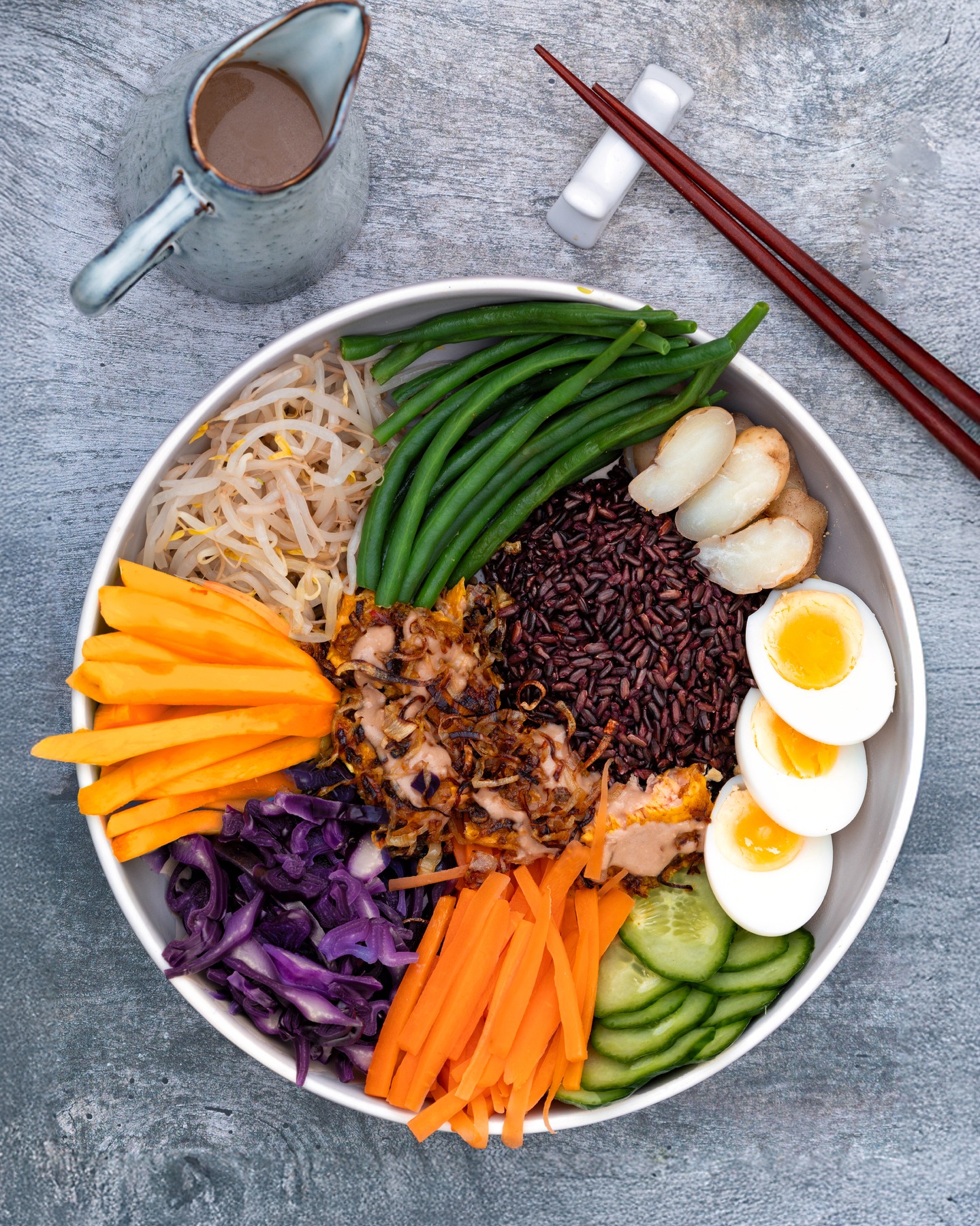 Inspired by Nina Olsson's approach to the Indonesian classic Gado Gado, I created my own version today. Instead of the traditional tempeh, I opted for beautifully pan-fried salmon, adding a lovely richness to this flavour-packed bowl.
My recipe included a delicious medley of red and black rice forming the base, topped with sweet chunks of mango, perfectly boiled egg, crisp blanched cabbage, tender potato and carrots, and a generous scattering of crunchy bean sprouts. 🥭🍚🥚🥕
Not forgetting my luscious, creamy peanut sauce drizzled generously over everything, tying all those delicious textures and tastes together. Seriously satisfying and such a great way to use up any stray veggies lurking in the salad drawer! 🥗
@nourish_atelier
#gadogado #fusionfood #ninaolsson #bowlsofgoodness #goodfoodkitchen #scratchcooking