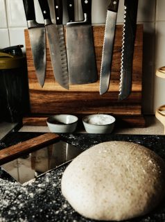 Bench-rested sourdough on a marble pastry board, scraper beside it, knives in the background. Slightly rustic, but the dough’s doing the talking here. It’s just relaxed enough now - ready for shaping into a boule and then into the fridge before tomorrow morning's bake.

#sourdoughbaking